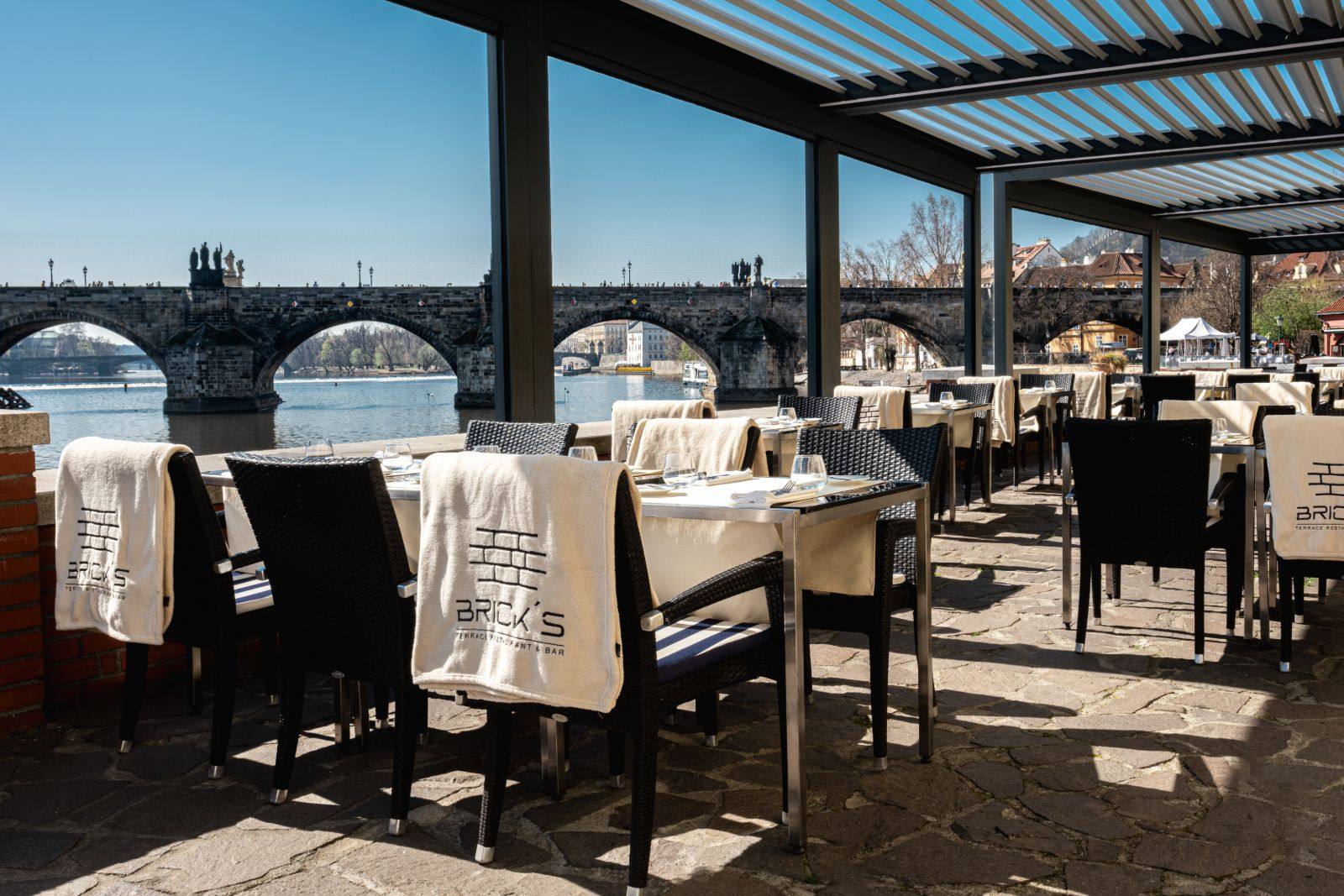 BRICK’S riverside terrace with Charles Bridge across the Vltava